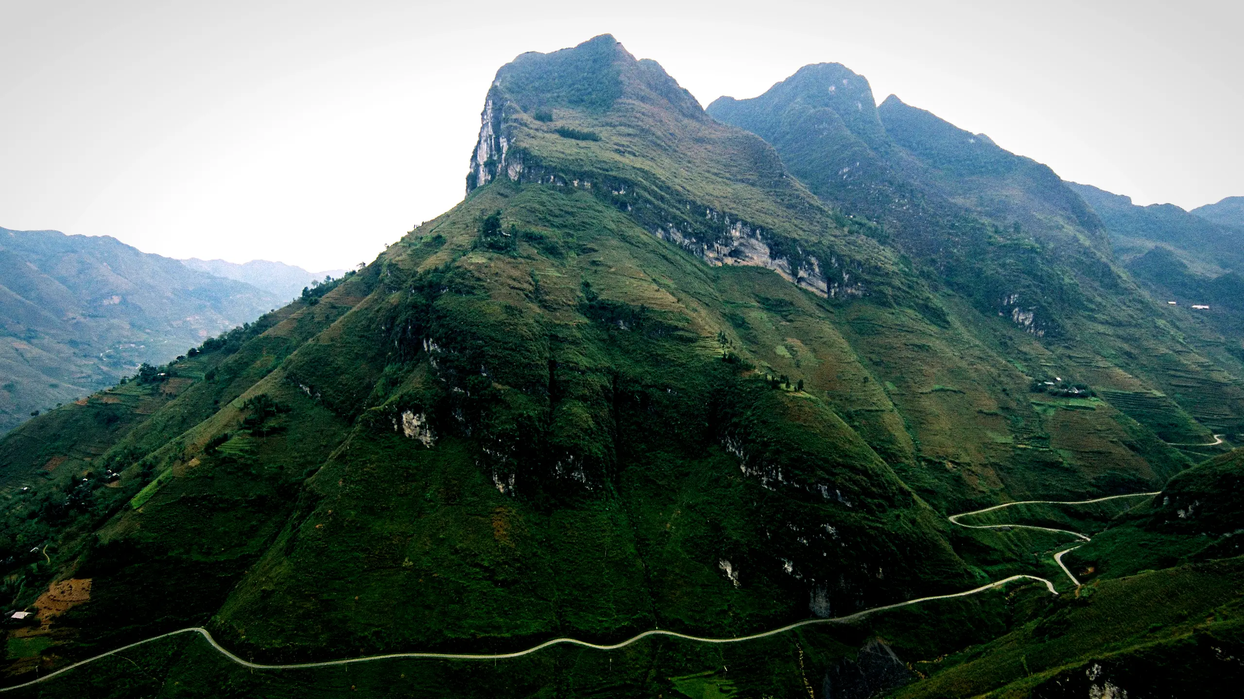 The Ma Pi Leng road cut into the mountainside above the Nho Que river, Ha Giang