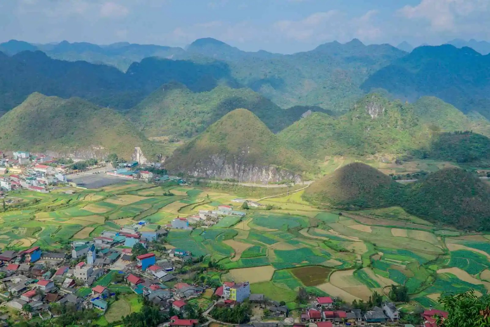 Ha Giang Loop packing list - mist rolling over the Quan Ba valley