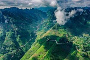 Ha Giang rainy season landscape with dramatic clouds over the mountains