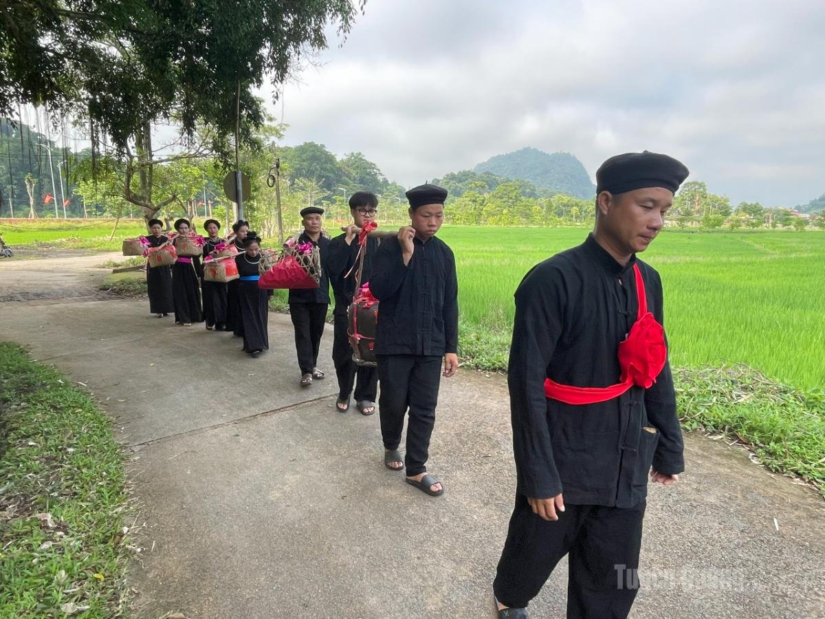 Tay People of Ha Giang: Culture, Villages & a Traditional Wedding 4 Tay people wedding procession carrying gifts through the rice fields