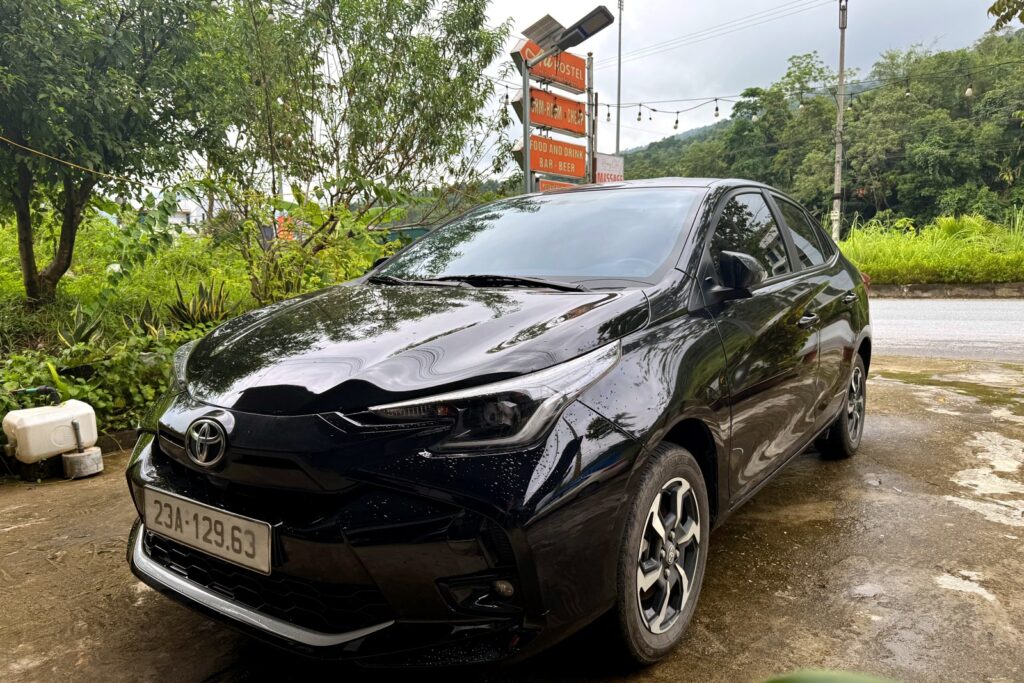 Toyota Vios 2025 self-drive rental car at Ali Hostel Ha Giang, front three-quarter view
