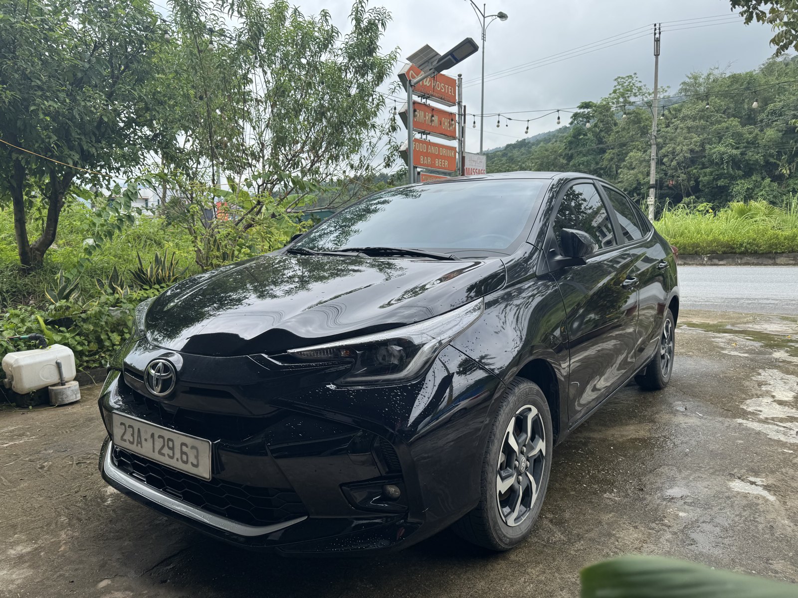 Private car for the Ha Giang Loop with kids, parked at Ali Hostel