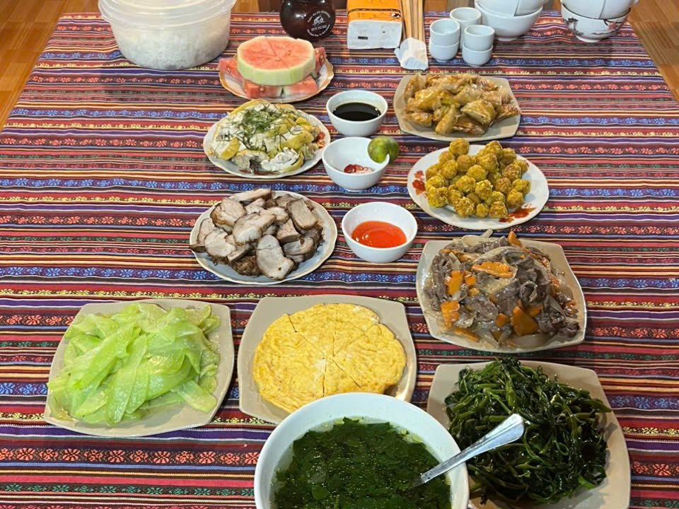 Homestay dinner in Du Gia where Ha Giang happy water is poured into small cups