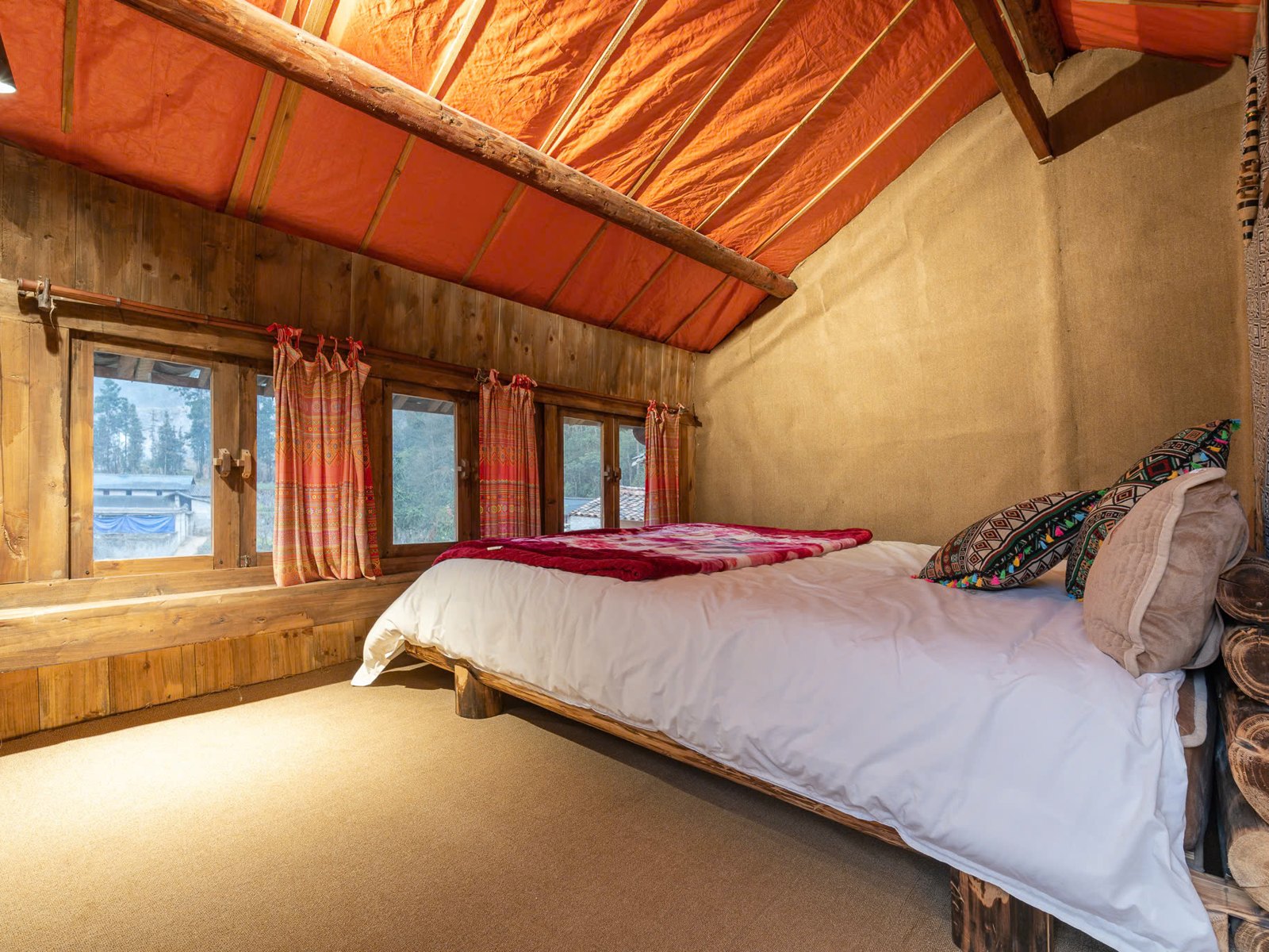 Private room with a double bed at a homestay in Lao Xa on the Ha Giang Loop