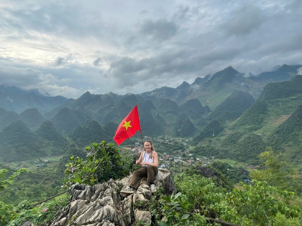 Ha Giang Loop in August: green karst valley under summer cloud