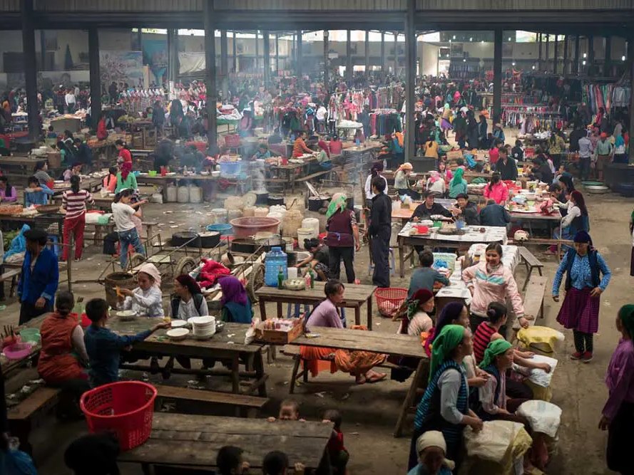Dong Van Sunday market hall, busy with local families on the Ha Giang Loop in December