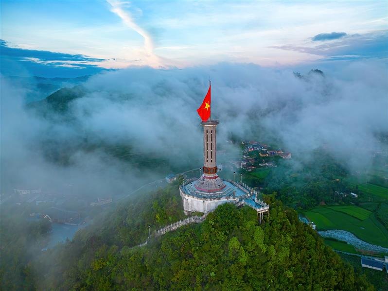 Lung Cu Flag Tower above a sea of cloud in winter on the Ha Giang Loop in December