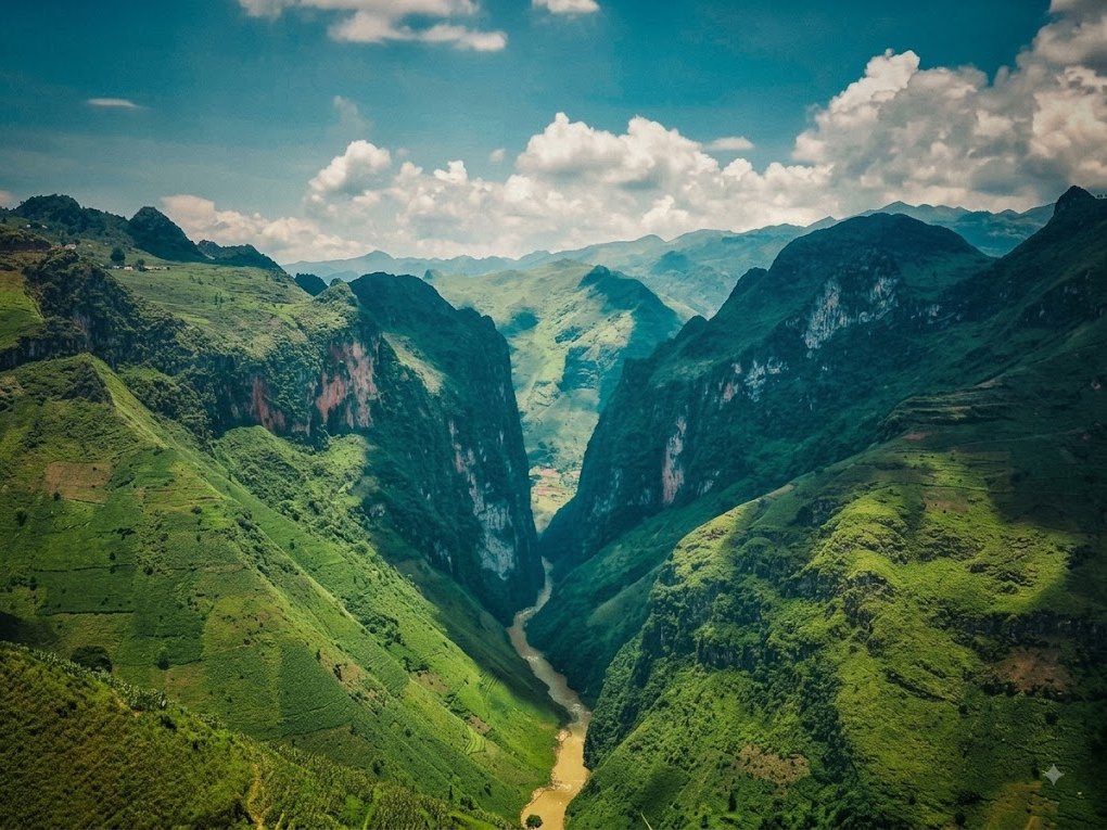 Ha Giang Loop in July: Should You Ride the Wettest Month? (2026 Guide) 6 The Nho Que River running brown through Tu San Canyon after a summer downpour in Ha Giang