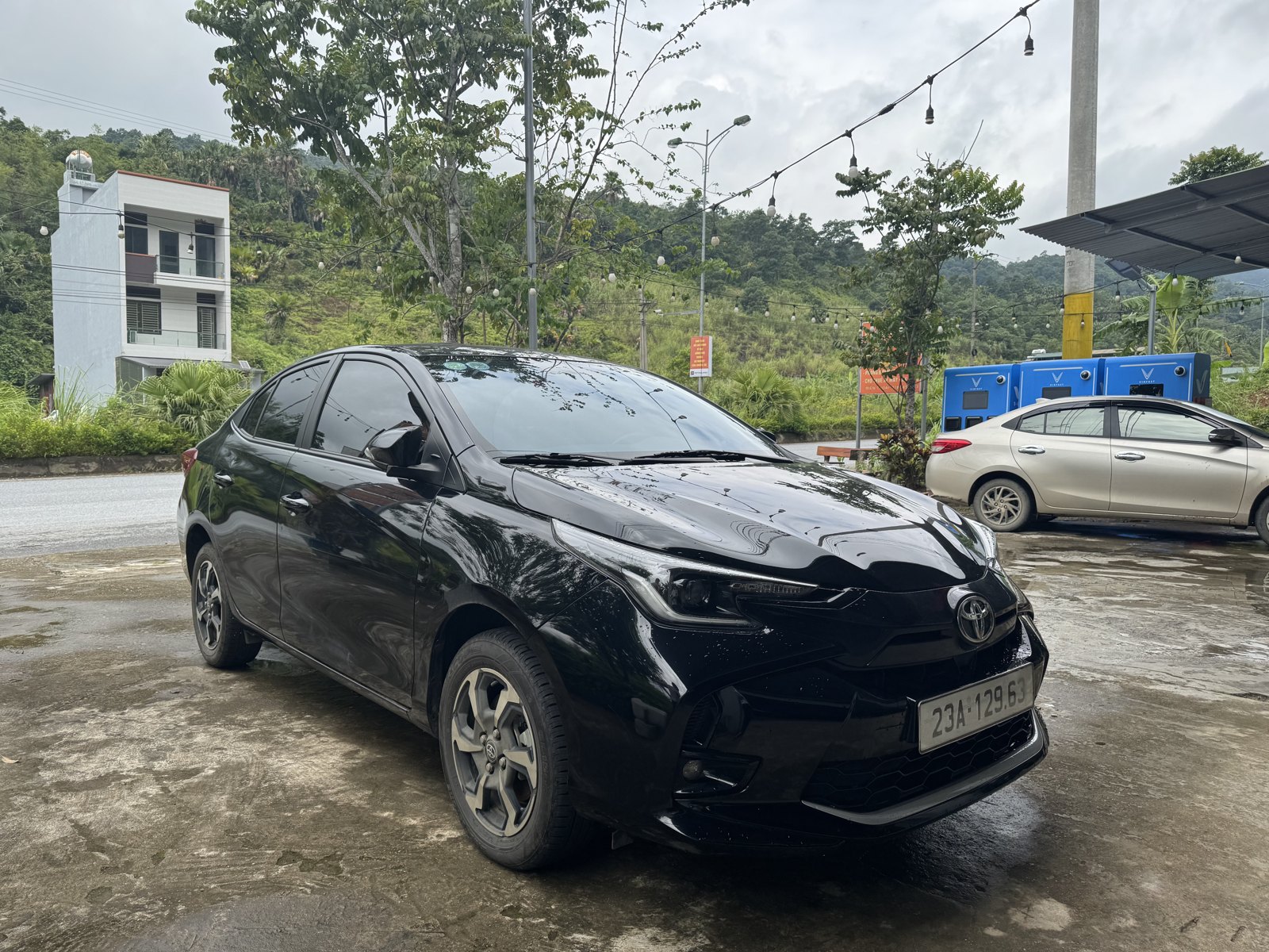 Private car for a Ha Giang Loop private tour, parked outside Ali Hostel