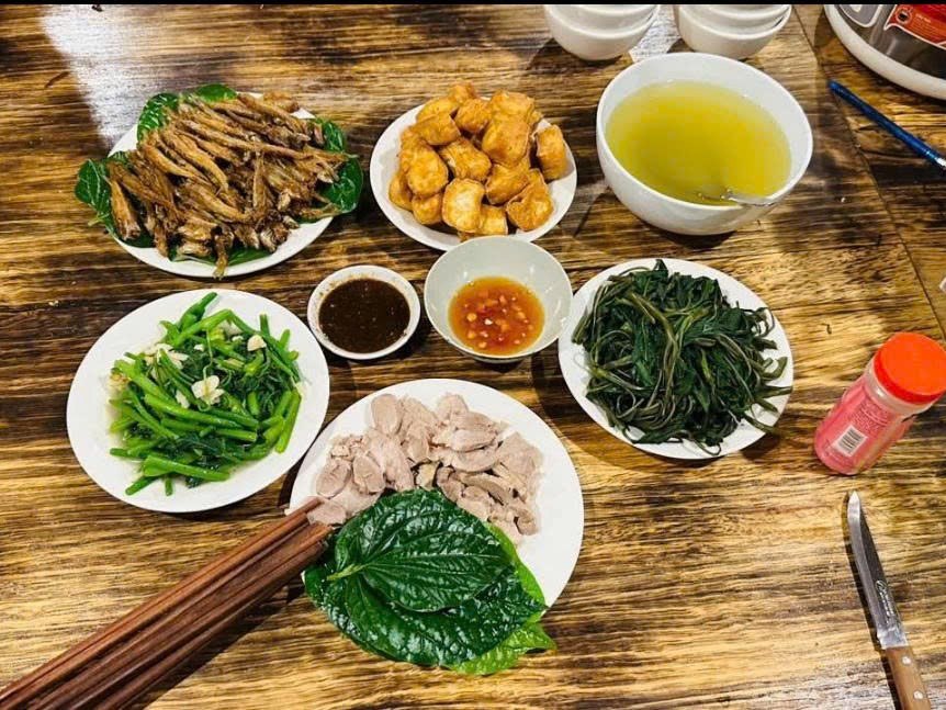 Fried tofu, green beans and stir-fried greens on a Ha Giang Loop lunch table