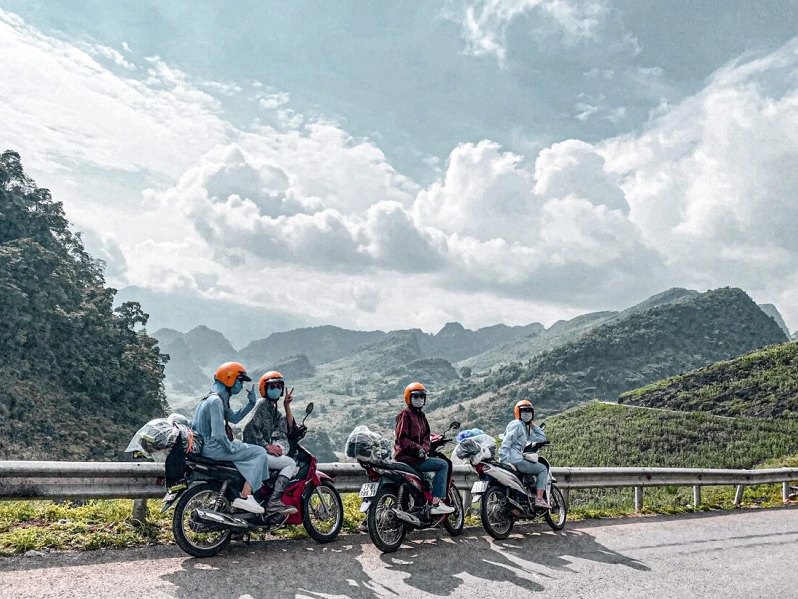 Is the Ha Giang Loop Worth It? An Honest Local Verdict (2026) 2 Riders stopping at a viewpoint near Ma Pi Leng Pass - is the Ha Giang Loop worth it