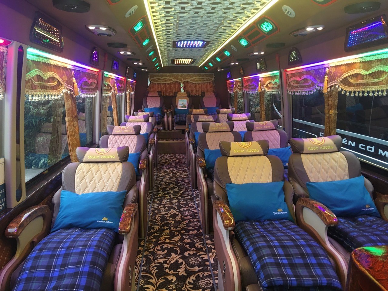 Sleeper bus interior with blankets and pillows for the overnight ride from Ha Giang