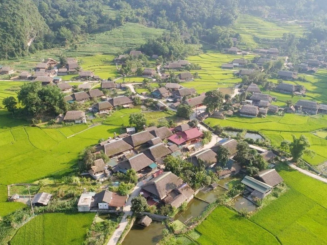 Aerial view of Tha Village, a Tay village of stilt houses and rice fields