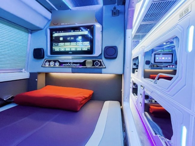 Single cabin on a VIP cabin bus from Hanoi to Ha Giang with its own screen and light