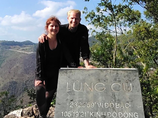 Ali Travel guests at the Lung Cu coordinates marker near the northern tip of Vietnam