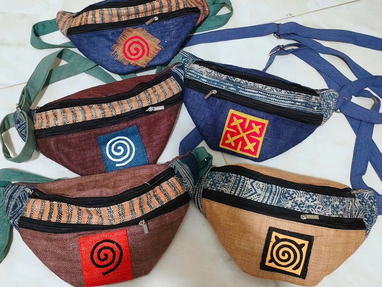 Hemp and embroidered belt bags sold at the Lung Tam cooperative shop
